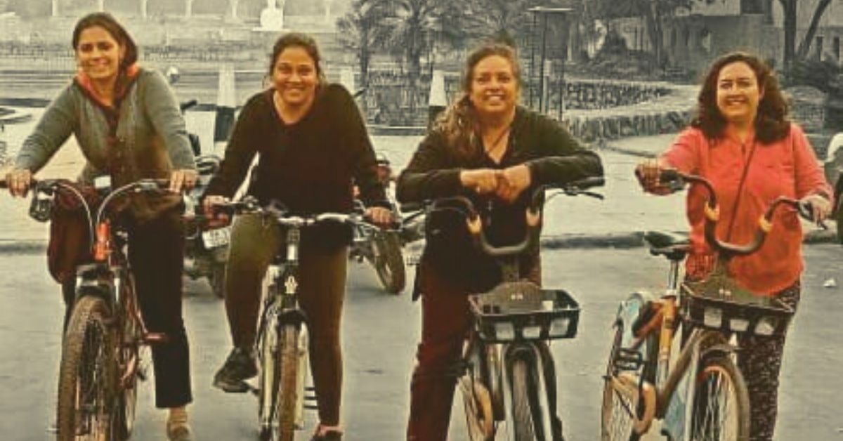 happy woman cycling group