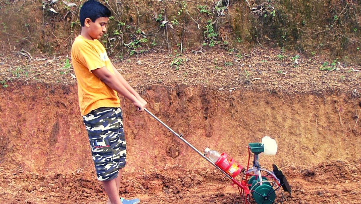 Rakeshkrishna K with his Seed Sowing Machine 