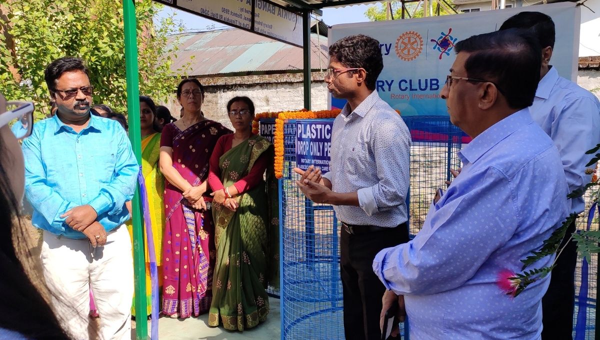 Sanjay K Gupta discussing with people 