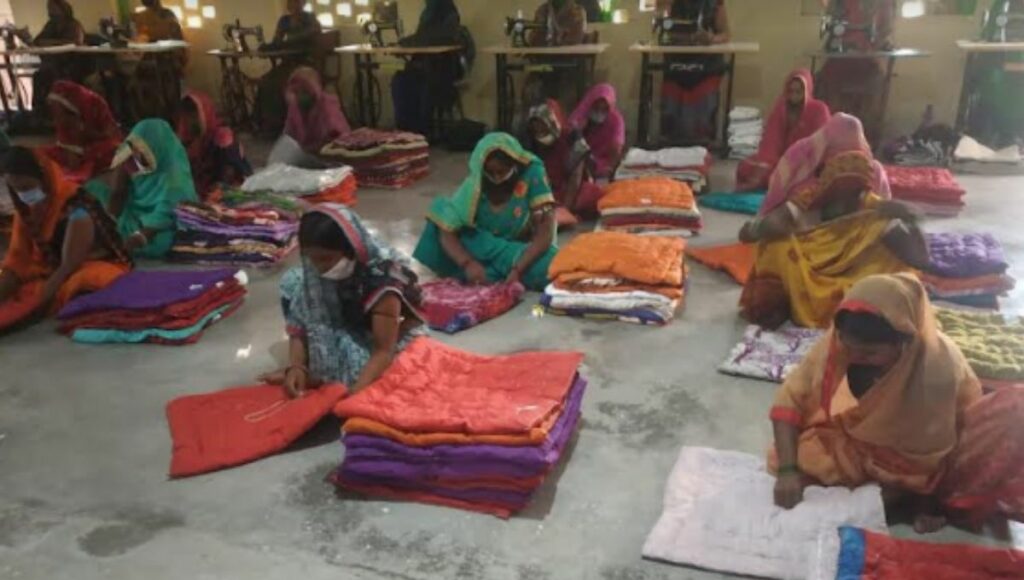 Women making padding of old clothes in Sujani Center, Bihar
