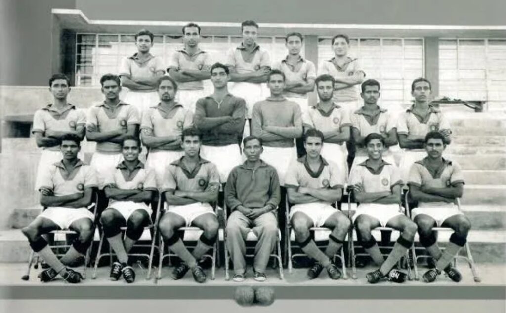 Indian coach Syed Abdul Rahim sitting in the first row with the football team (center).
