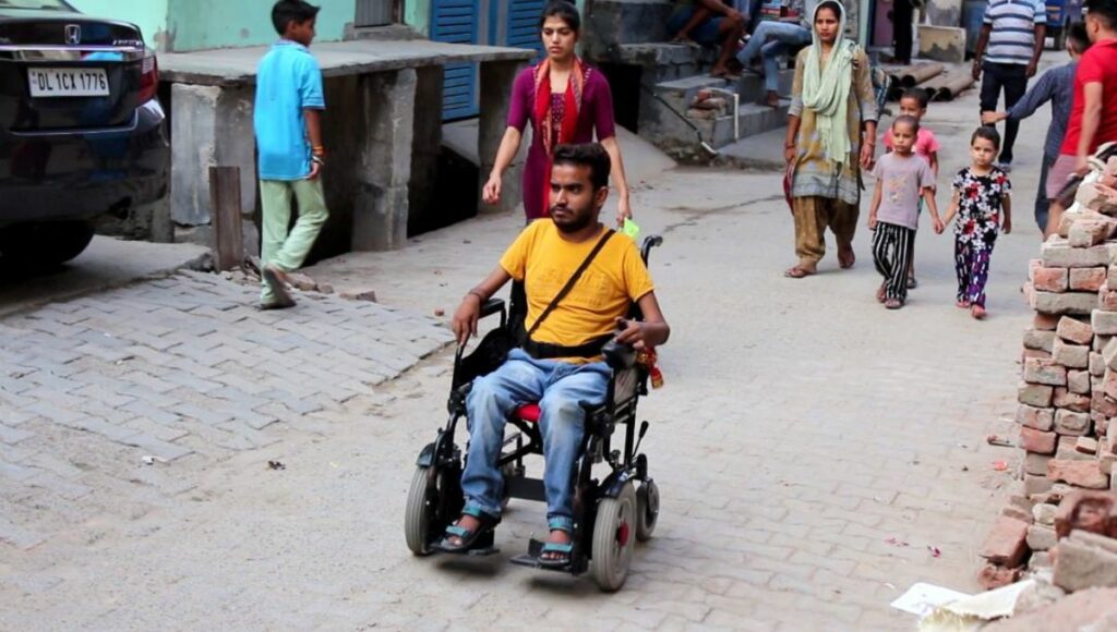 Shriram Ojha on his electric wheel chair 