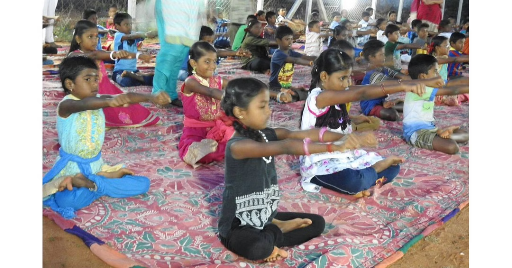 Students doing Yoga at Kalvi Thunai