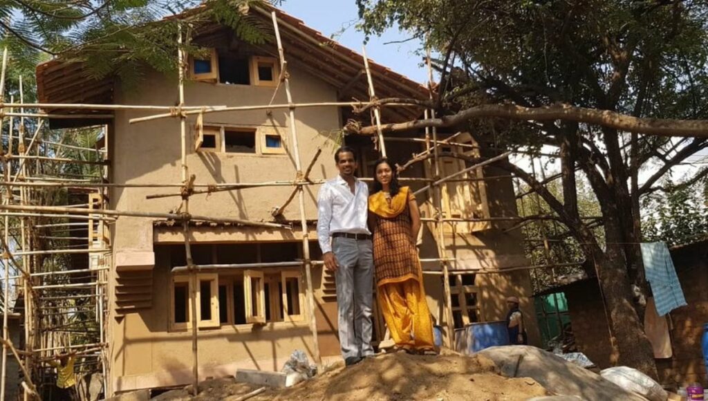 Avnit  with his family outside his  sustainable home in pune 