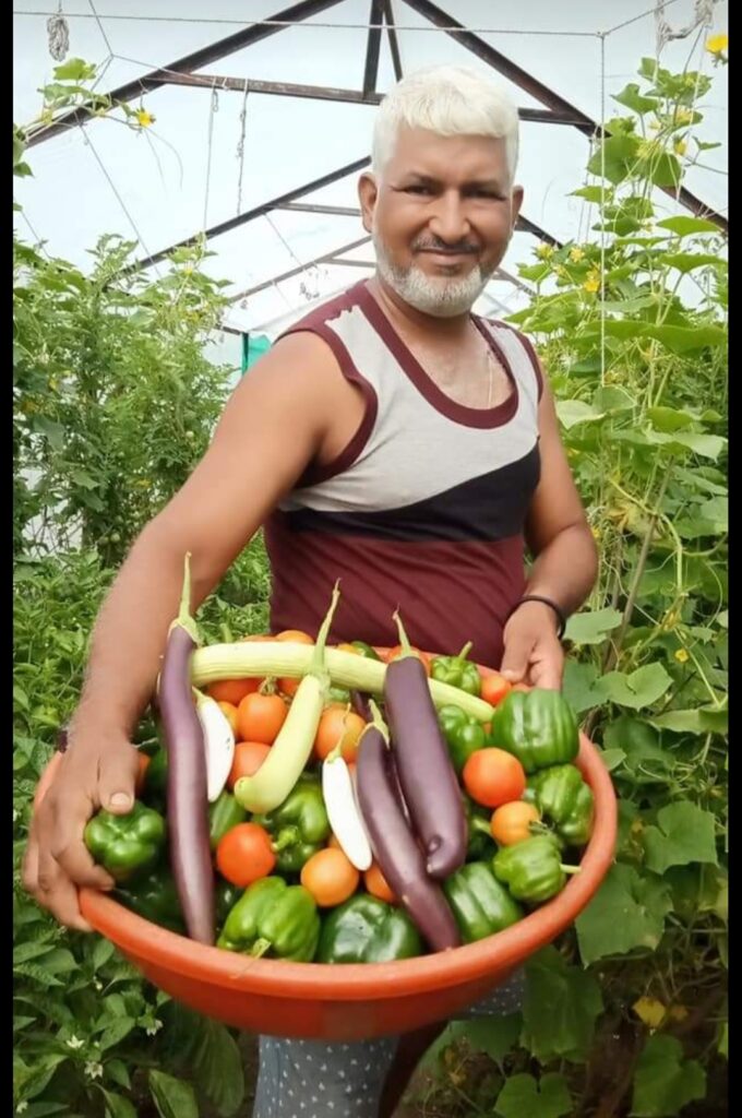 Farmer Chandra Shekhar showing his organic products.