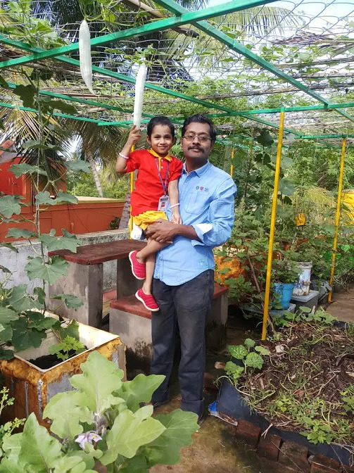 Thayumanavan with his daughter in the terrace garden