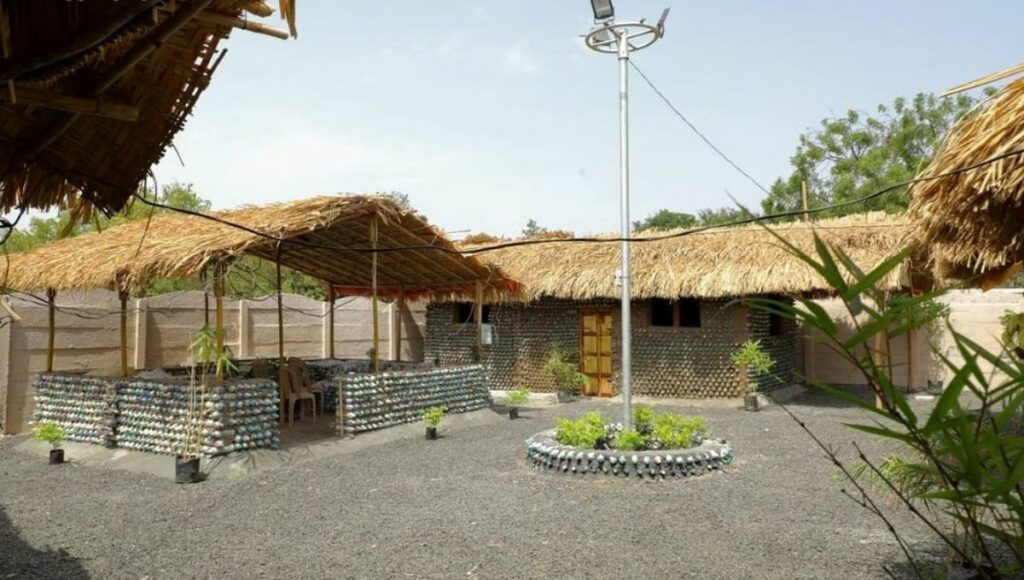 Their eco-friendly house comprises two square-shaped rooms which are partially open, and one round hut.